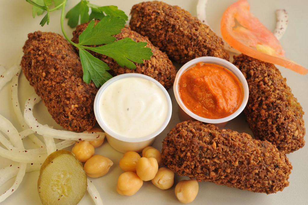 Falafel Side 6 · Chickpeas, onion, garlic, parsley, cilantro and mom's secret spices ground together and deep fried in vegetable oil in the form of sticks. ONLY FALAFEL SAUCES IS EXTRA ON THE SIDE