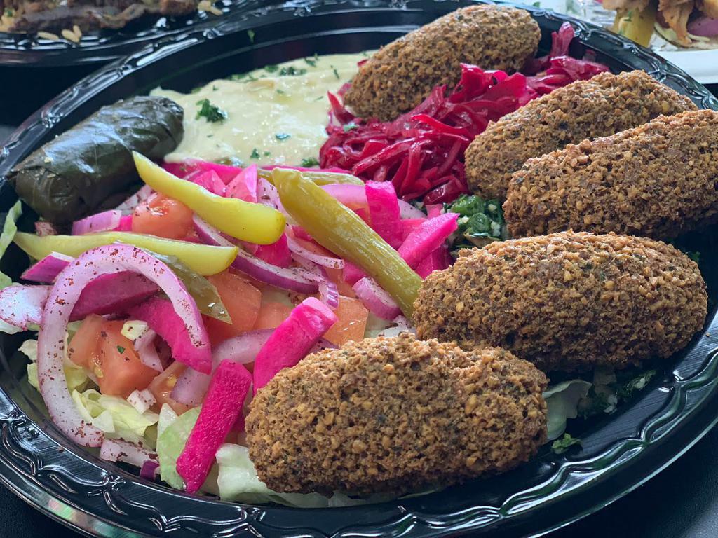 Falafel Platter · Our original blend of chickpeas, onion, garlic, parsley, cilantro and mom's secret spices, ground together and deep fried in vegetable oil in an oval shape. Includes choice of side.