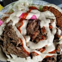 Shawarma Platter · Thinly sliced beef and lamb marinated in our secret spice blend, stacked and roasted to perf...