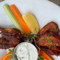 Mild Wings · Our signature mild wing sauce served with carrots celery and blue cheese