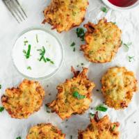 Zucchini Croquettes · Zucchini and cheese fritters with yogurt cucumber sauce.