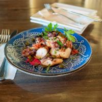 Grilled Octopus · charred leg of octopus on a bed of arugula fingerling potatoes, tomatoes, red onion, olives,...