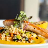 Salmon ala TRU · pan seared salmon over pearl couscous, roasted mixed vegetables, carrot puree sauce