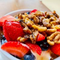 Yiaourti/Greek Yogurt Parfait  · Greek yogurt topped with natural honey, nuts, and berries.