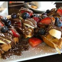Dessert Waffle · Waffles topped with banana, blueberries, strawberries, Nutella.
