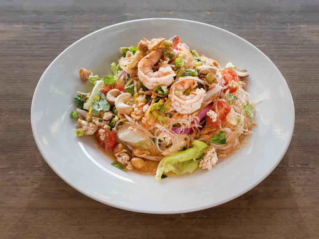 Yum Woon Sen · Spicy. bean thread glass noodle, shrimp, mince chicken, tomato, red onion, scallion, cilantro, chinese celery, fried shallot, peanut, cashew nut, chili and lime juice ~New York Times Recommended~