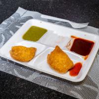 1 Vegetable Samosa · A fried pastry with a savory potato filling.