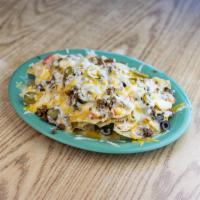 Macho Nacho Supreme with Salsa · Corn tortilla chips with choice of beef or chicken, cheddar cheese, onion, black olives, tom...