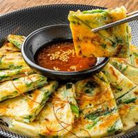 Scallion Pancake with Seafood (해물파전) · Crispy and chewy pancake with scal&lion, mixed seafood (squids, mussels, shrimps) and vegeta...