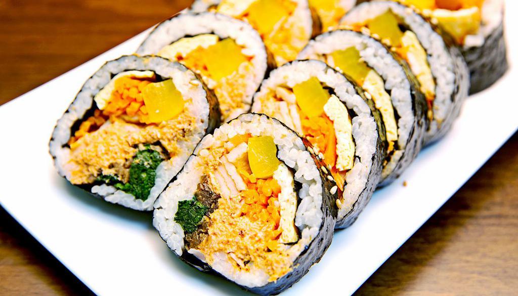 Spicy Tuna Kimbap (매운참치 김밥) · Spicy tuna salad, yellow pickle radish, burdock, egg, spinach, fish cake, sesame oil and seasoned rice with seaweed.