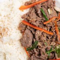 Bulgogi over Rice (불고기덮밥) · Thinly sliced rib eye and vegetables marinated in bulgogi sauce served over white rice and m...
