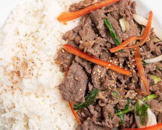 Bulgogi over Rice (불고기덮밥) · Thinly sliced rib eye and vegetables marinated in bulgogi sauce served over white rice and miso soup.