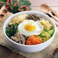 Bibimbap (비빔밥) · White rice, medley of vegetables topped with a fried egg and miso soup. 