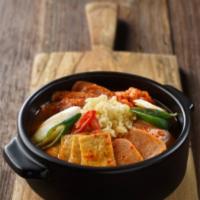 Army Stew (부대찌개) · Budae Jjigae. Spicy stew with kimchi, tofu, spam, sausage, rice cakes , ramen noodles. Serve...