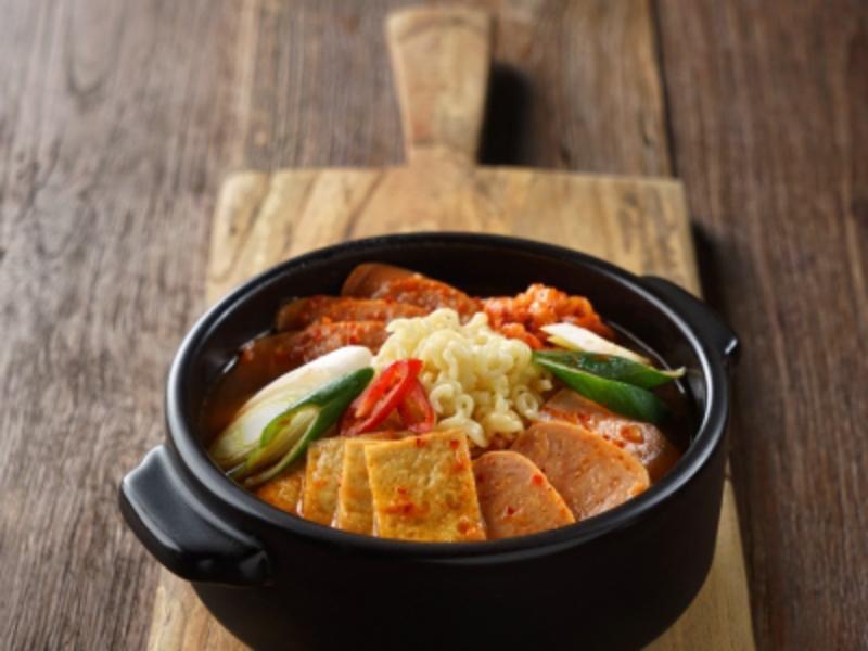 Army Stew (부대찌개) · Budae Jjigae. Spicy stew with kimchi, tofu, spam, sausage, rice cakes , ramen noodles. Served with rice. Spicy.