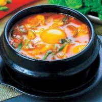 Seafood Soft Tofu Soup (해물순두부) · Soft tofu stew with Seafood, vegetables, soft tofu and egg in spicy broth. Served with rice. 