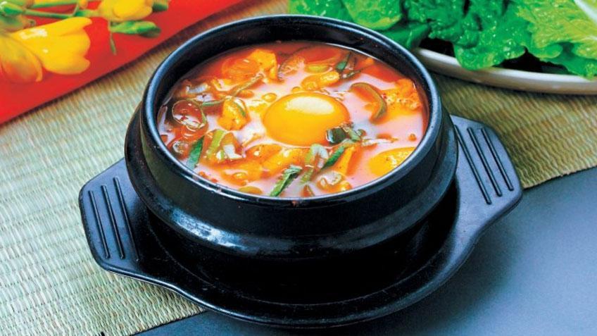 Seafood Soft Tofu Soup (해물순두부) · Soft tofu stew with Seafood, vegetables, soft tofu and egg in spicy broth. Served with rice. 