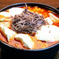 Beef Soft Tofu Soup (소고기순두부) · Soft tofu stew with Beef, vegetables, soft tofu and egg in spicy broth. Served with rice. 