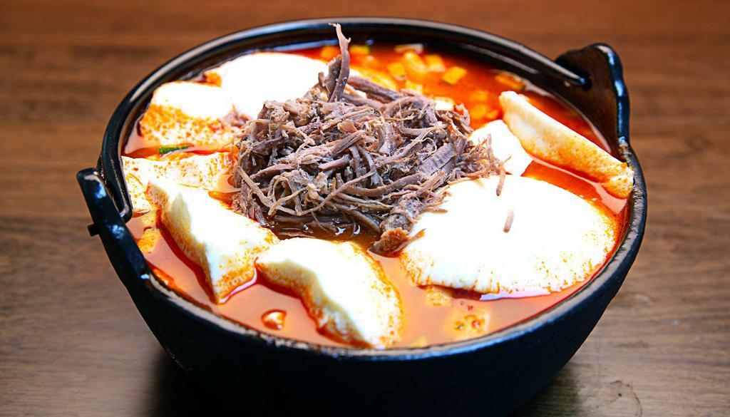Beef Soft Tofu Soup (소고기순두부) · Soft tofu stew with Beef, vegetables, soft tofu and egg in spicy broth. Served with rice. 