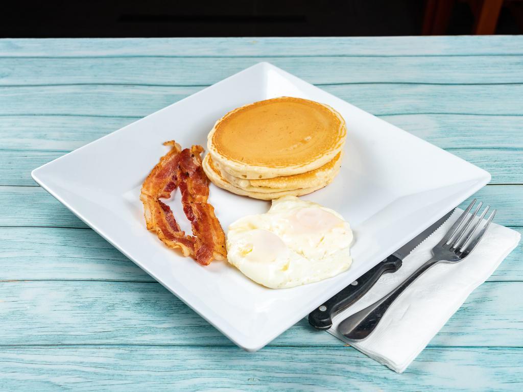 Pancakes Deluxe · 2 eggs any style, ham or bacon or sausage.