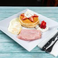 Pancakes con Fresa with Strawberry · 2 eggs any style, ham, bacon or sausage.