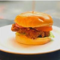 Fried chicken sandwich and 1 side · Breaded Chicken Breast on a bun with tomato, lettuce and your choice of dressing and a side. 