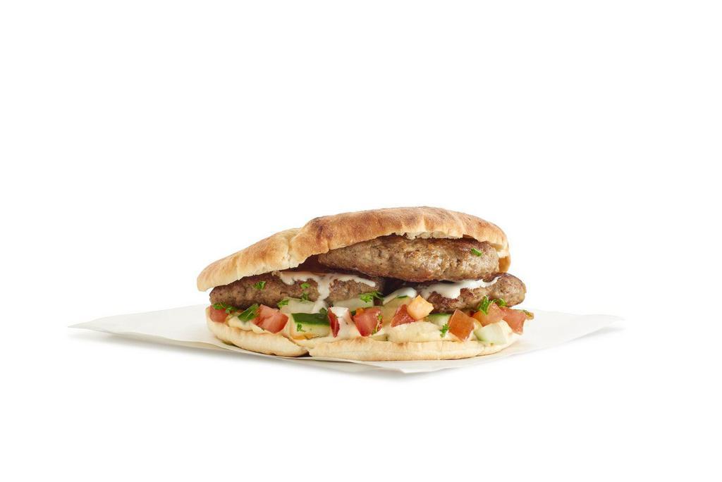 Lamb Kofta Sandwich · Grilled lamb patty with onions, parsley, mint, and spices.