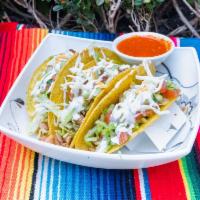 Crispy Tacos · Folded tortilla with a variety of fillings such as meat or beans. 