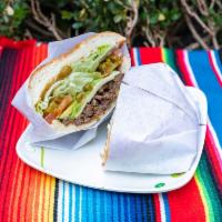Tortas · All server with: Black beans spread, cheese, tomato, avocado, jalapeños, lettuce and mayonna...