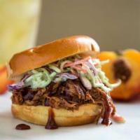 BBQ Pulled Pork Sandwich · Slow roasted dry rubbed pulled pork shoulder, topped with Buffalo mozzarella, apple slaw and...
