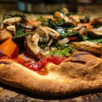 Garden Pizza · Broccoli, spinach, fresh tomatoes, roasted garlic, and mozzarella.