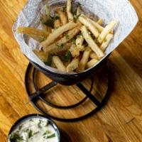 Truffle Fries · Crispy thin cut shoestring fries are fried to perfection in our canola oil and then lightly ...