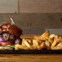 Bourbon Burger · Juicy burger patty glazed in our homemade whiskey sauce served on a pretzel bun with mayo an...