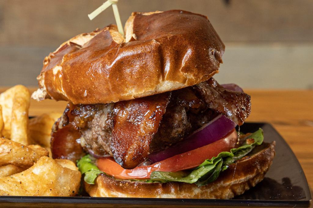 Maple Bacon Jam Burger · Maple glazed Applewood smoked bacon strips, homemade bacon-jam under melted gruyere cheese served with a crisp romaine lettuce leaf all on a toasted pretzel bun.