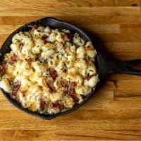 Three Cheese Mac · Our perfect trio of blended mozzarella, fancy cheddar, and american cheeses will remind you ...