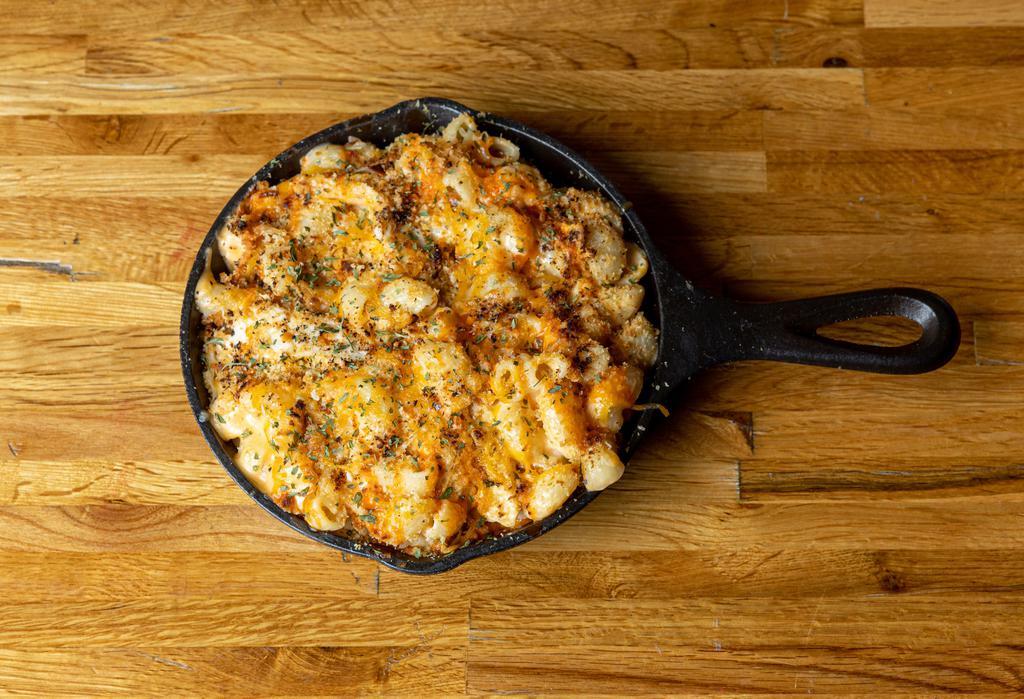 Cheesy Buffalo Chicken Mac · Spice it up with our creamy and zesty buffalo chicken macaroni and cheese made with cayenne buffalo sauce, blended yellow cheeses and juicy chicken.