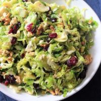 Gorgonzola Salad · Mixed Greens, Dried Cranberries, Candied Walnuts, Gorgonzola Cheese & Raspberry Vinaigrette