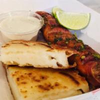 Chorizo Con Arepitas  · Grilled Colombian chorizo, served with arepitas, garlic mayo and lime. Gluten free.