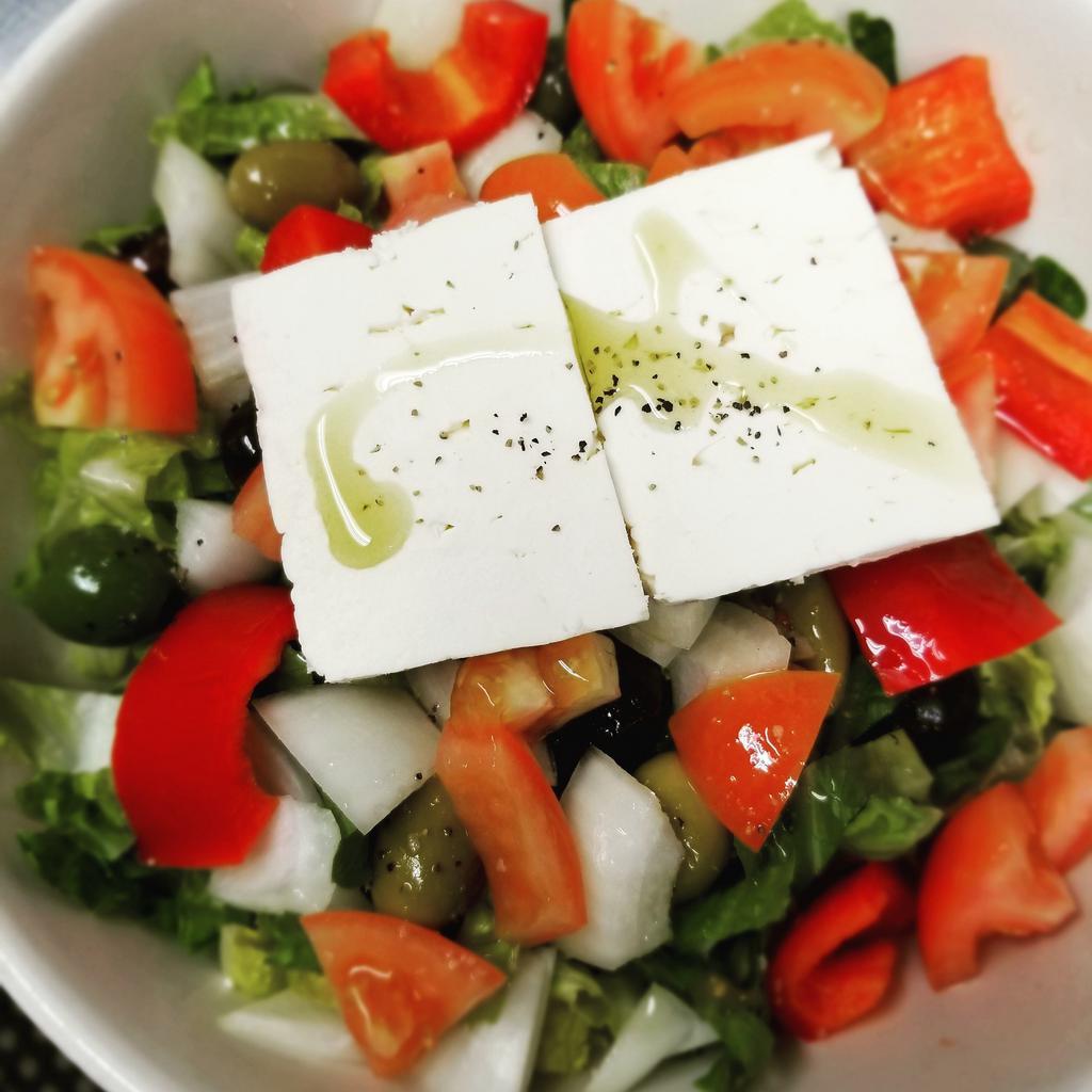 Traditional Greek Salad · Feta cheese, assorted olives, plum tomatoes, cucumber, red onion, bell peppers and extra virgin olive oil.