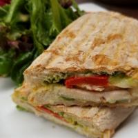 Roasted Turkey Panini · Served with smoked mozzarella, roasted red pepper and fresh basil on ciabatta bread. Comes w...