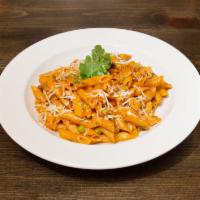 Pasta Buttera · Served with sweet and hot Italian sausage, filetto di pomodoro tomatoes sauce, fresh basil a...