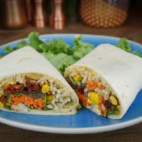 The Dharma Wrap · Yellow curry hummus, spinach, carrots, onions, fire-roasted corn, sun-dried tomatoes and bro...