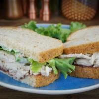 Thanksgiving Leftovers Sandwich · Sliced turkey, house-made cranberry spread, mayo and green leaf lettuce on wheat bread.
