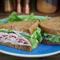 Ham and Cheese Sandwich · Honey smoked ham, Swiss, spicy mustard, mayo and green leaf lettuce on rye bread.