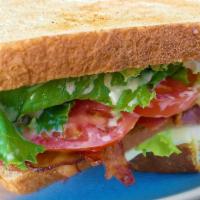 Dad's BLT Sandwich · Hardwood-smoked bacon, tomatoes, mayo and green leaf lettuce on wheat bread.