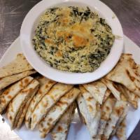 Spinach and Artichoke Dip · Served hot with toasted pita bread.