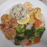 Grilled Scallops and Shrimp · Served with wild rice and sauteed mixed veggies.