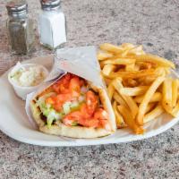 Chicken Gyro Sandwich · Includes tomatoes, lettuce, onions and our own yogurt sauce on grilled pita bread. Served wi...