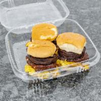 Tres Golpes Sliders (3 to an order) · Fried egg, fried cheese, and fried salami on a slider bun.