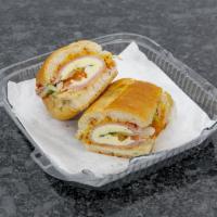 Bodega Sandwich · A mouth watering combination of ham, cheese, shredded lettuce, onions, tomatoes, mayo, musta...